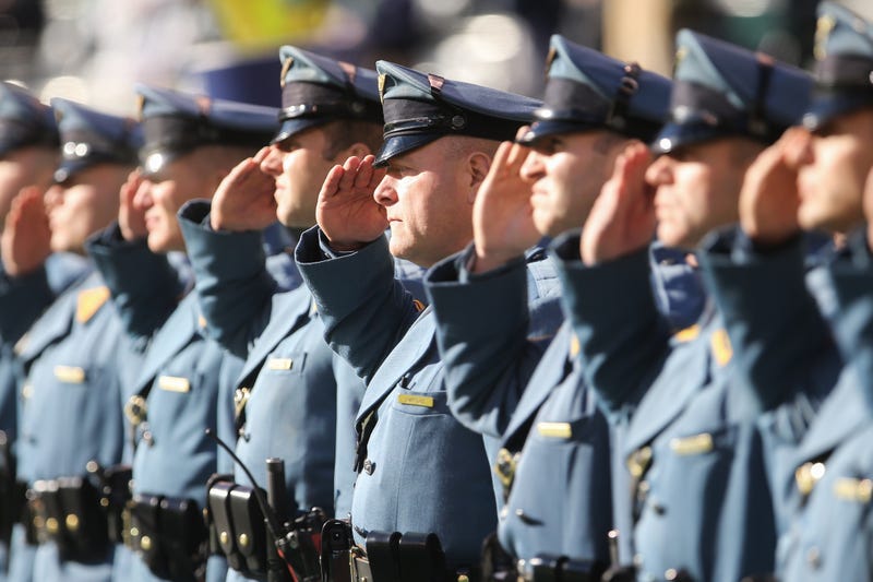 Members of the New Jersey State Police line up prior to the start of the NFL game between the New York Jets and the Buffalo Bills at MetLife Stadium on January 1, 2017 in East Rutherford, New Jersey.