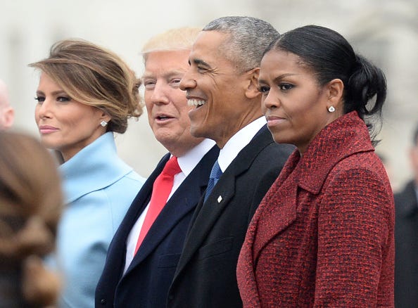 President Donald Trump (2nd-L) First Lady Melania Trump (L), former President Barack Obama (2nd-R) and former First Lady Michelle Obama walk together following the inauguration, on Capitol Hill in Washington, D.C. on January 20, 2017.