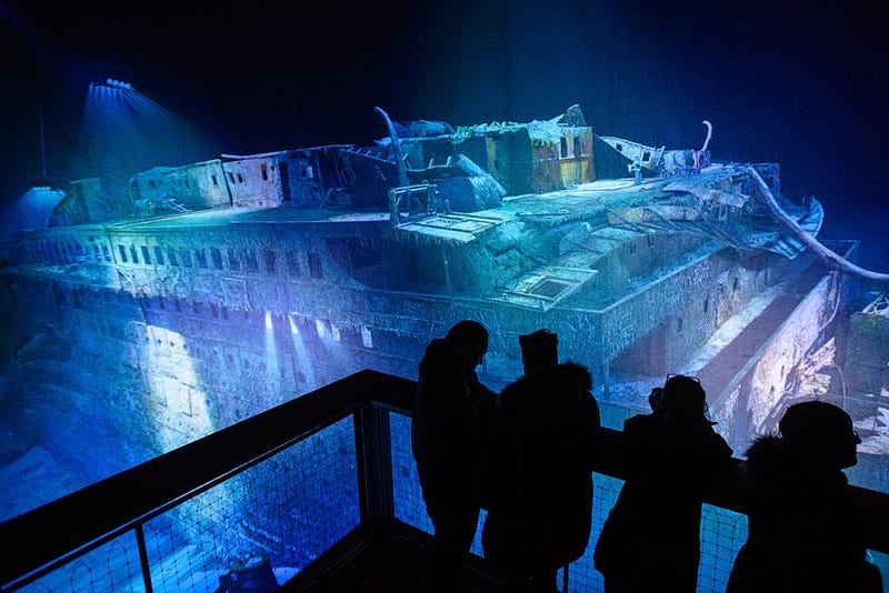 People look at a large-scale 360 degree panorama presentation of the Titanic shipwreck by artist Yadegar Asisi during a press preview on January 27, 2017 in Leipzig, Germany.