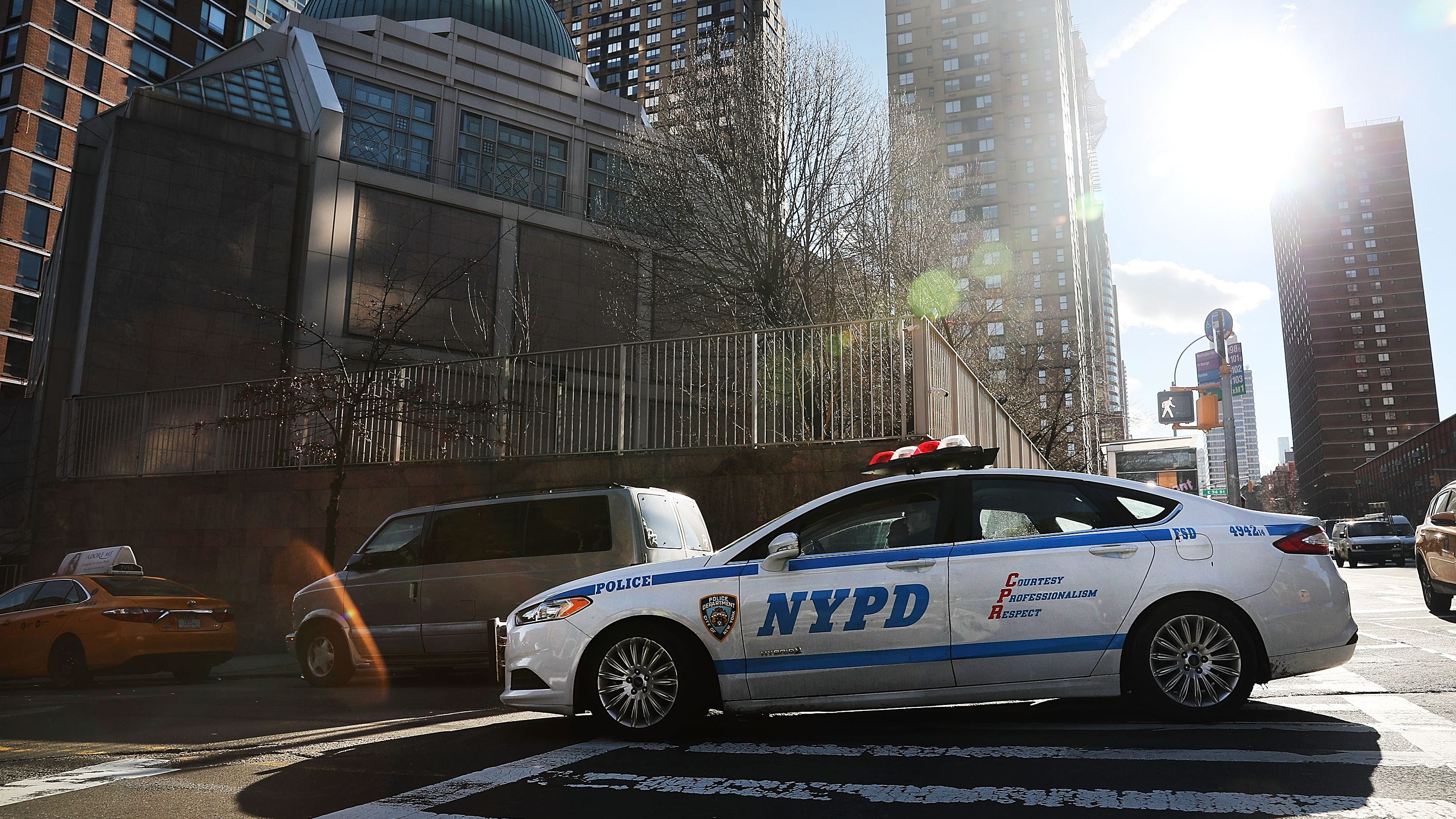 SUV T-bones NYPD car as it drives through red light responding to burglary