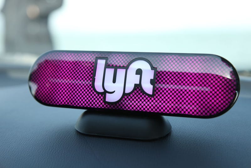FILE - An Amp sits on the dashboard of a Lyft driver's car on Jan. 31, 2017 in San Francisco, Calif.