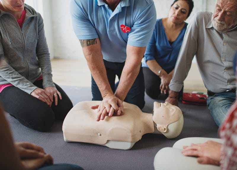 People demonstrating CPR 