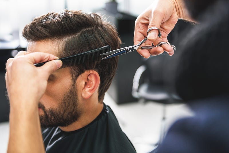 man getting hair cut