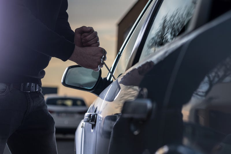 Person stealing a car. 
