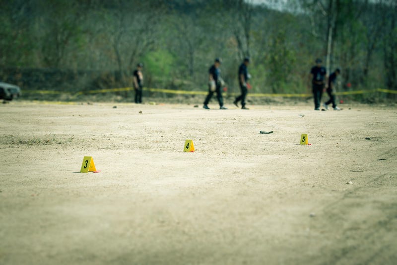 Police searching empty lot