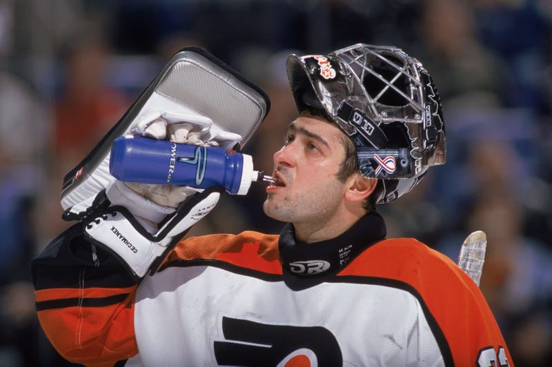 Goaltender Roman Cechmanek, #32 of the Philadelphia Flyers, drinks water during the NHL game against the Buffalo Sabres at the HSBC Arena in Buffalo, New York, April 1, 2002. 