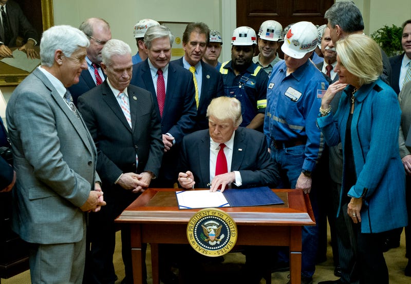 During his first term in office, U.S. President Donald Trump signs H.J. Res. 38, disapproving the rule submitted by the US Department of the Interior known as the Stream Protection Rule in the Roosevelt Room of the White House on February 16, 2017 in Washington, DC. The Department of Interior's Stream Protection Rule, which was signed during the final month of the Obama administration, "addresses the impacts of surface coal mining operations on surface water, groundwater, and the productivity of mining operation sites," according to the Congress.gov summary of the resolution. 