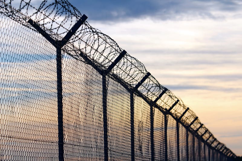 Barbed wire fence at a prison. 