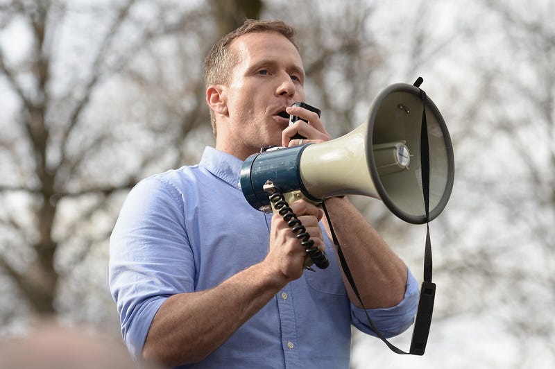 Eric Greitens speaks into a megaphone.