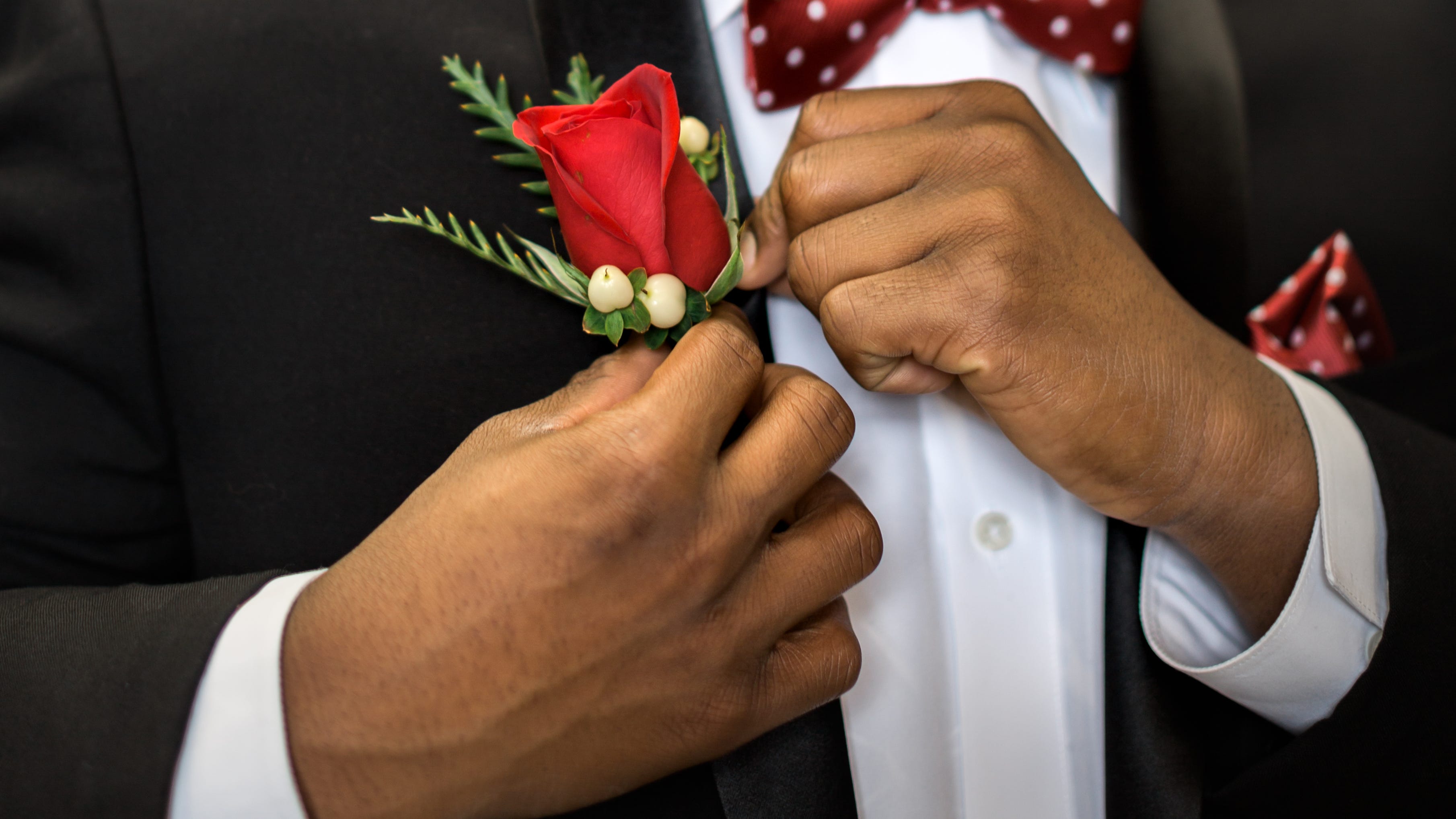 DFW group of mentors take students suit shopping for prom