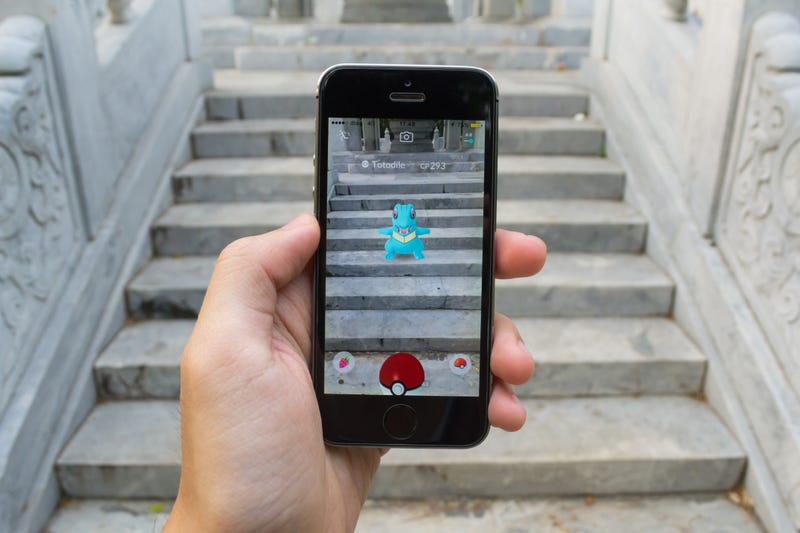 A Pokemon monster viewed on a person's phone