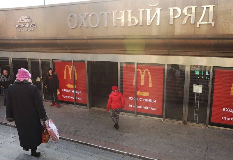 Russians walk into a McDonald's restaurant in Moscow on March 7, 2017 in Moscow, Russia.