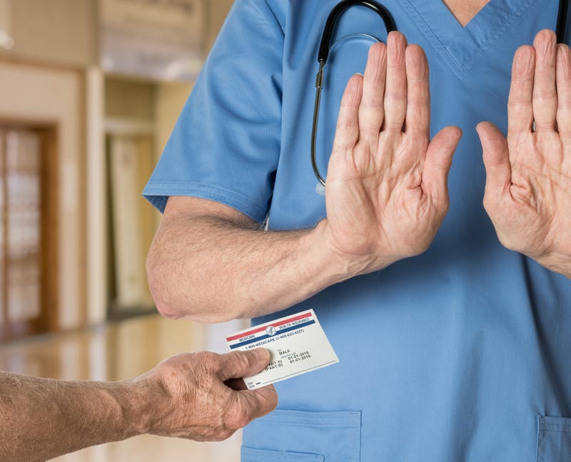 Doctor refusing Medicare stock photo.