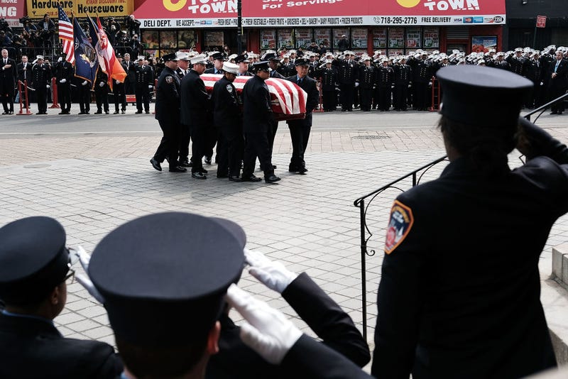 The casket for New York City fire department (FDNY) EMT Yadira Arroyo is brought into St. Nicholas of Tolentine R.C. Church in the Bronx on March 25, 2017 in New York City.