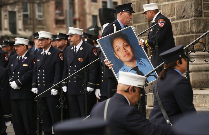 A picture of New York City fire department (FDNY) EMT Yadira Arroyo is brought into St. Nicholas of Tolentine R.C. Church in the Bronx during her funeral on March 25, 2017 in New York City.