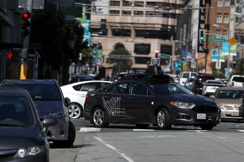 An Uber self-driving car drives down 5th Street on March 28, 2017 in San Francisco, California. Cars in Uber's self-driving cars are back on the roads after the program was temporarily halted following a crash in Tempe, Arizona on Friday.