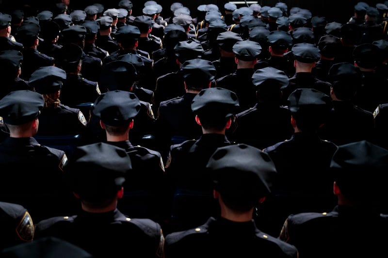 Law enforcement officers face stricter scrutiny on hiring and other standards after a state panel passed new rules about racism and other potentially provocative activities to consider.