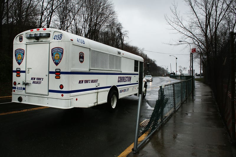 A Department of Correction bus enters Rikers Island