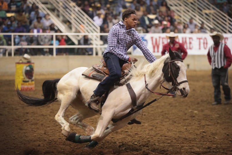 A cowboy participates in the relay race competition at the Bill Pickett Invitational Rodeo on April 1, 2017 in Memphis, Tennessee. 