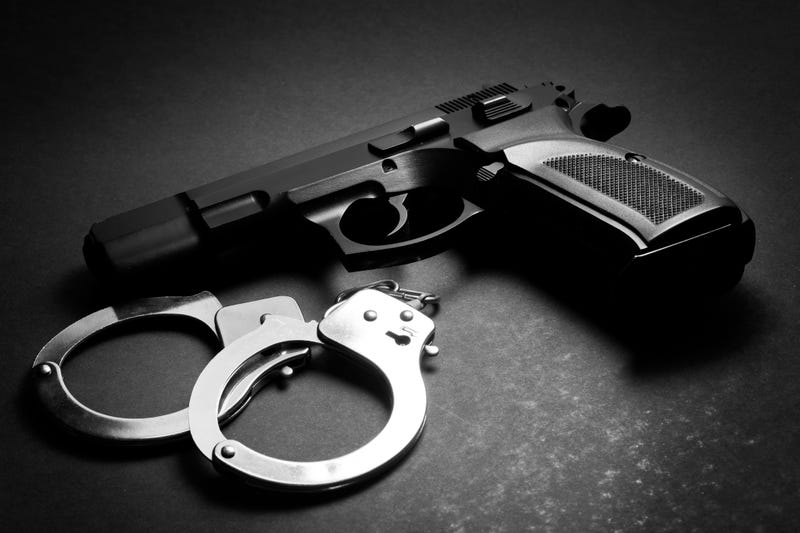 A handgun and handcuffs