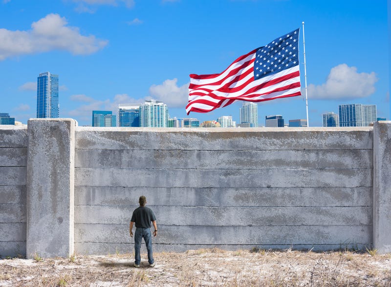 man looking at wall