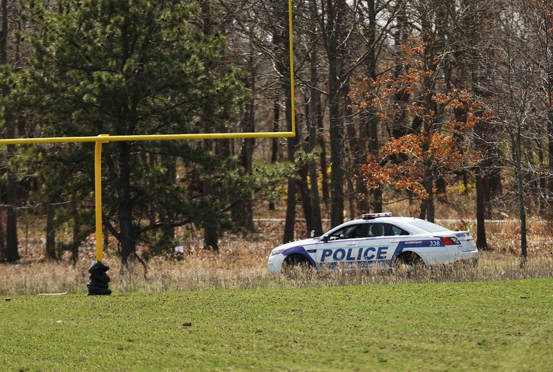 Police set up a crime scene at a park in Central Islip, Long Island.