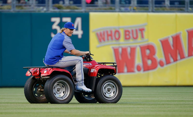 Noah Syndergaard, then #34 of the New York Mets, steals the Phillies Phanatic's ATV before a game against the Philadelphia Phillies at Citizens Bank Park on April 10, 2017.