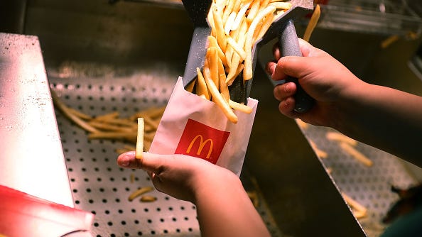 PHOTOS: Couple finds 60-year-old McDonald's fries in their bathroom wall