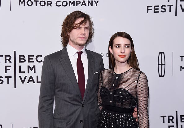 Emma Roberts and Evan Peters attend a red carpet together. 