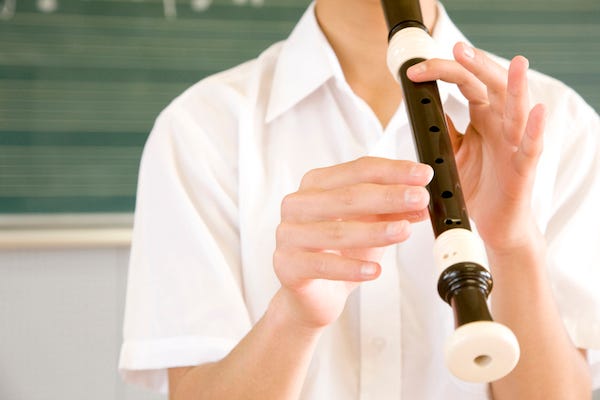 Student playing the recorder