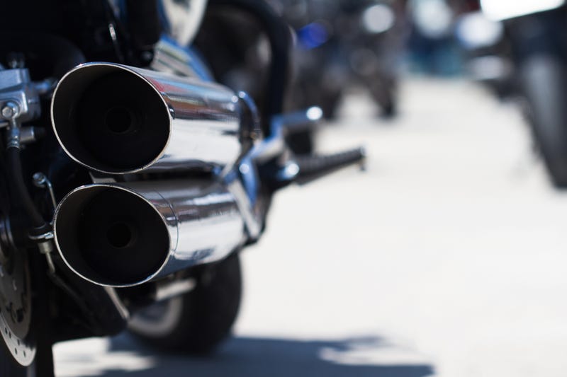 Motorcycle exhaust pipe stock photo.