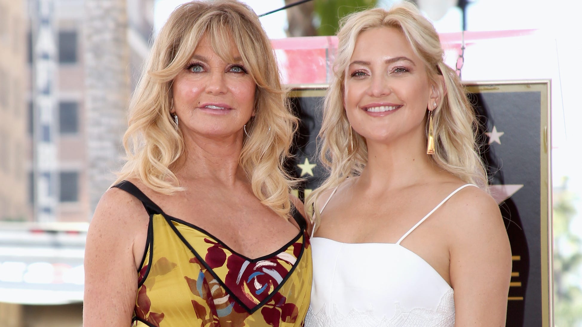 Kate Hudson, 42, soaks up the sun in striped bikini on a boat with mom Goldie Hawn