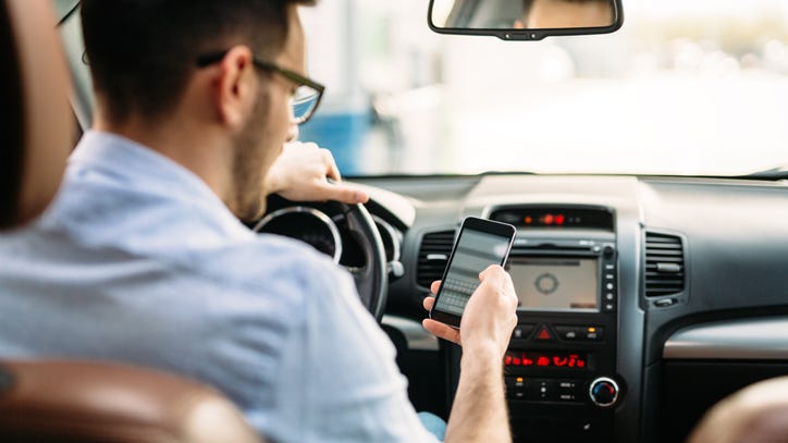 It will soon be illegal to talk on – or even hold – your phone while driving in Michigan