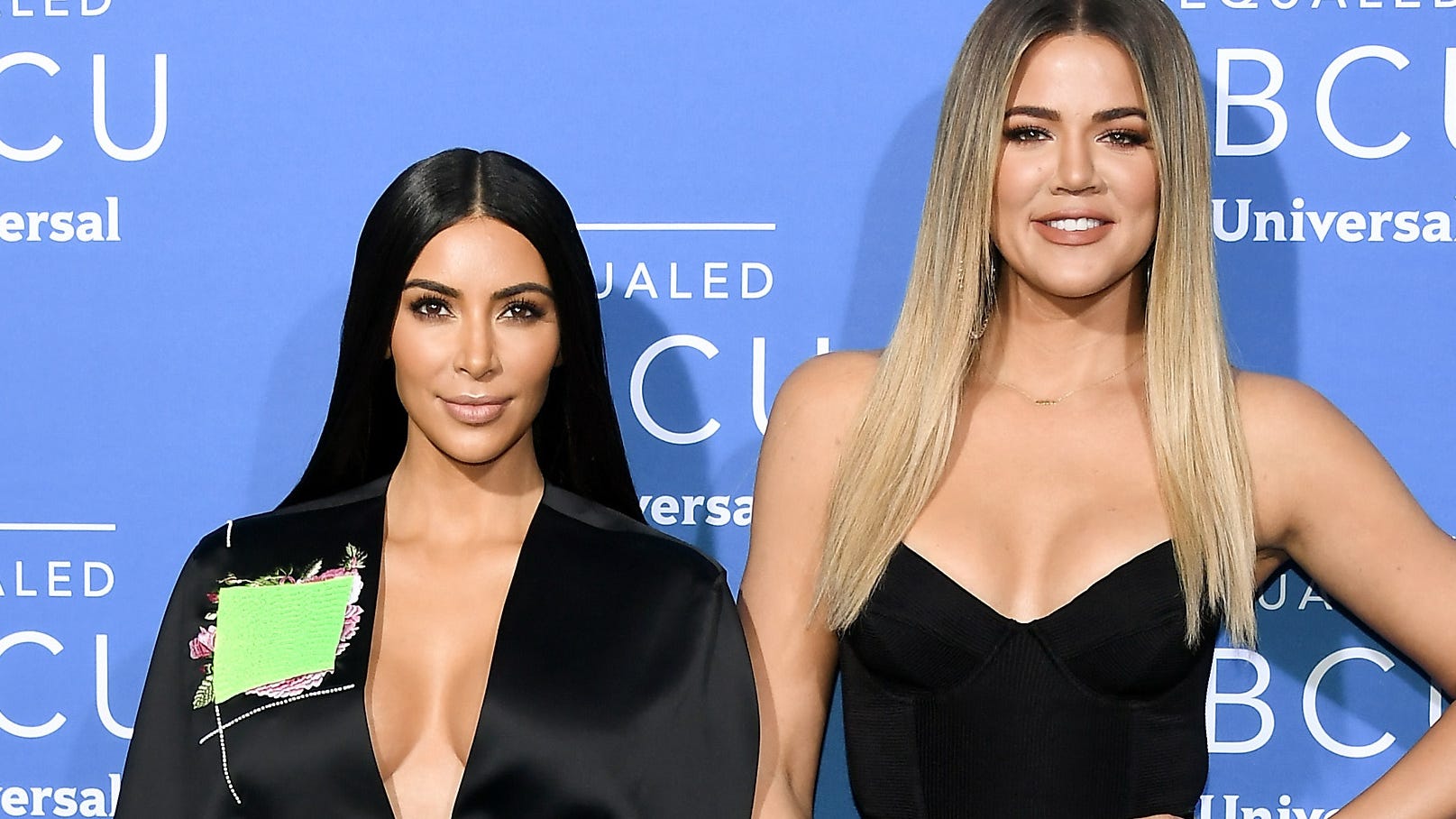 Kim and Khloe Kardashian go twinning in black bikinis during tropical getaway