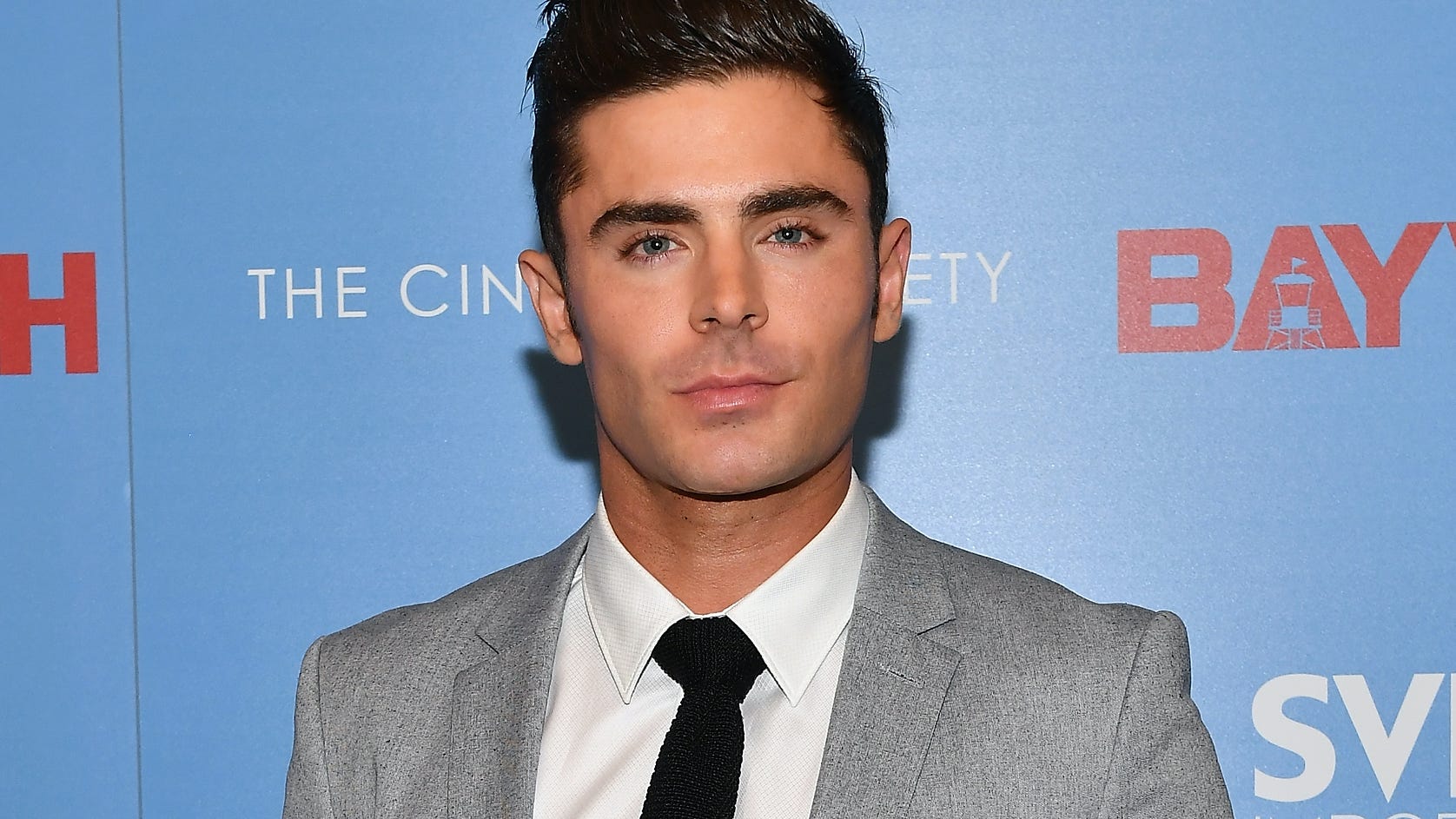 Shirtless Zac Efron swims with dolphins and cuddles kangaroos filming Netflix series ‘Down to Earth’