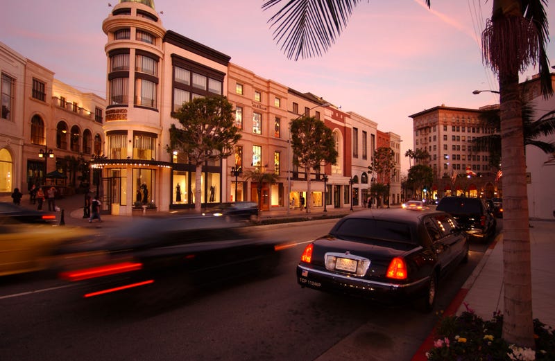 limo waits on curb at dusk