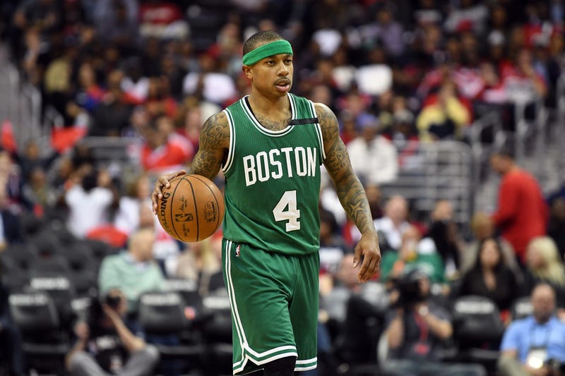 Former Celtics guard Isaiah Thomas dribbles the ball.