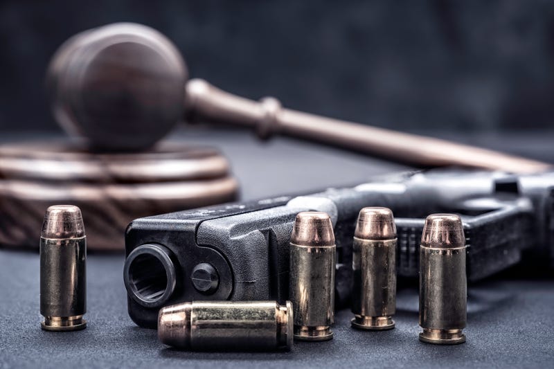 Gavel, gun and bullets