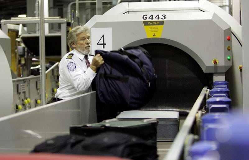 A Transportation Security Administration (TSA) worker monitors bags at the Oakland International Airport June 22, 2006 in Oakland, California.