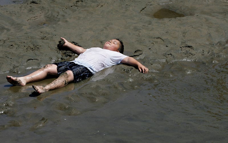 A young boy cools off in shallow water at Crissy Fields July 18, 2006 in San Francisco, California.