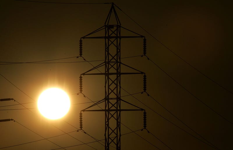 Power towers are seen as the sun sets July 24, 2006 in San Rafael, California.