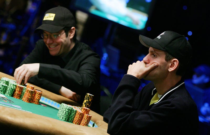 Chip leader Jamie Gold (L) of California and second place chip holder Allen Cunningham of Nevada compete during the World Series of Poker no-limit Texas Hold 'em main event at the Rio Hotel & Casino