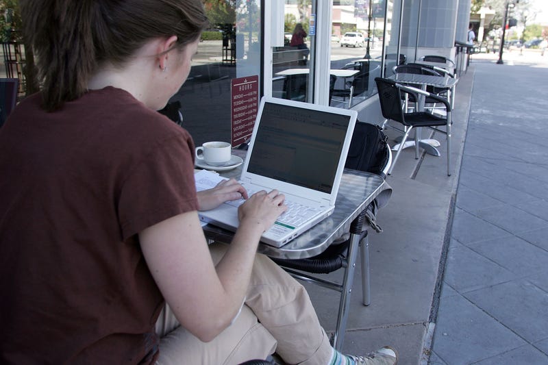 Michelle Rogers uses free Google WiFi while sitting outside of a cafe August 16, 2006 in Mountain View, California. 