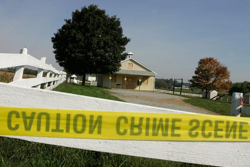 Crime scene tape is attached to a white fence in front of the one room Amish school house where the shooting took place two days prior, October 3, 2006 in Nickel Mines, Pennsylvania. Officials have said a milk truck driver identified as Charles Carl Roberts IV entered the schoolhouse, let the boys and adults go free, tied up the girls and shot them execution style before committing suicide. Five girls are dead and at least seven others injured.