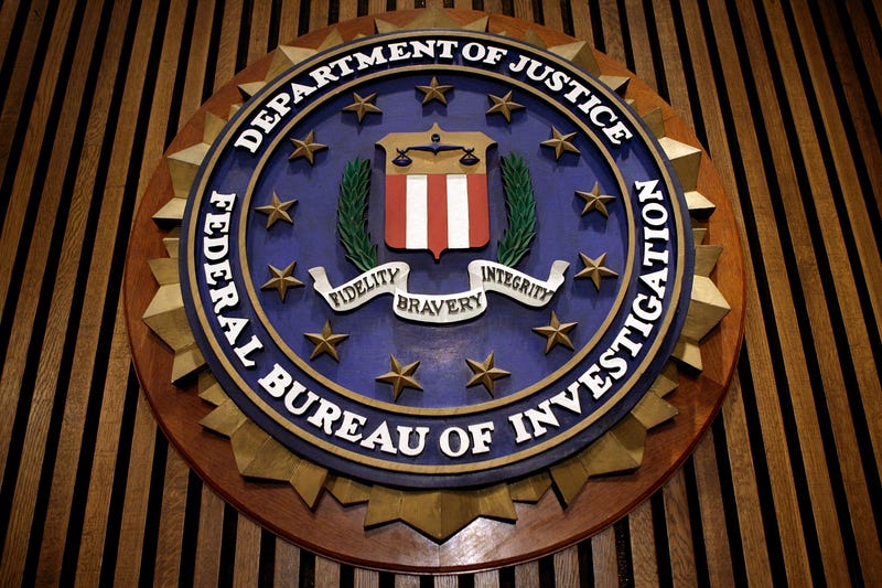 WASHINGTON - MARCH 09: The seal of the F.B.I. hangs in the Flag Room at the bureau's headquaters March 9, 2007 in Washington, DC. F.B.I. Director Robert Mueller was responding to a report by the Justice Department inspector general that concluded the FBI had committed 22 violations in its collection of information through the use of national security letters. The letters, which the audit numbered at 47,000 in 2005, allow the agency to collect information like telephone, banking and e-mail records without a judicially approved subpoena.