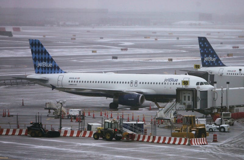 Jet Blue planes sit on the tarmac outside the Jet Blue terminal March 16, 2007 at John F. Kennedy Airport in New York City.