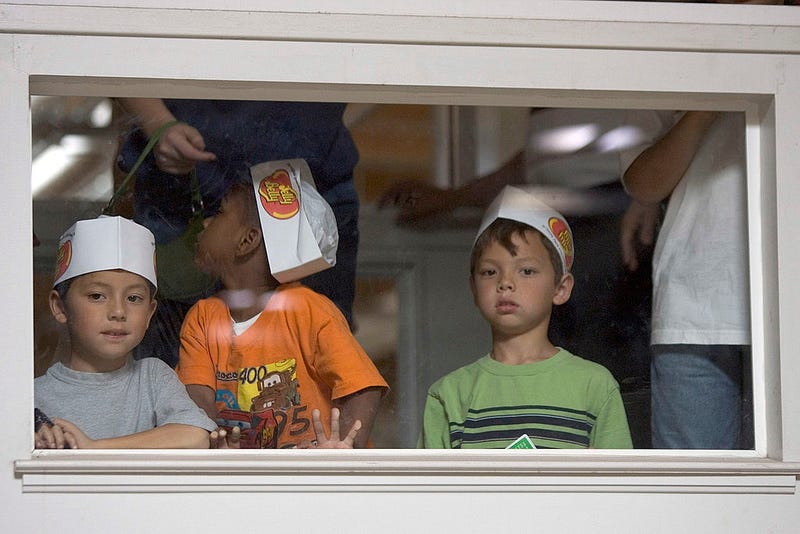FAIRFIELD, CA - APRIL 2: Children watch the assembly line workers at the Jelly Belly Factory April 2, 2007 in Fairfield, California. The Jelly Belly Factory produces approximately 14 billion jelly beans a year. With less than a week before Easter Sunday, retailers stock their shelves full of jelly beans, chocolates, and other traditional candies for Easter.
