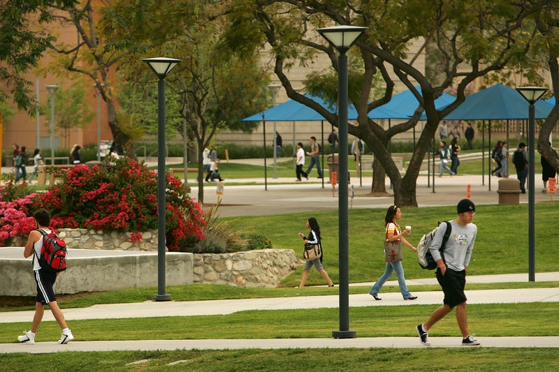 students walk across campus