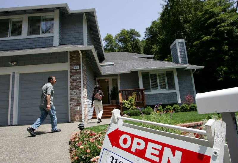 Real estate agents arrive at a brokers tour showing a house for sale with a list price of $1.3 million May 17, 2007 in San Rafael, California.