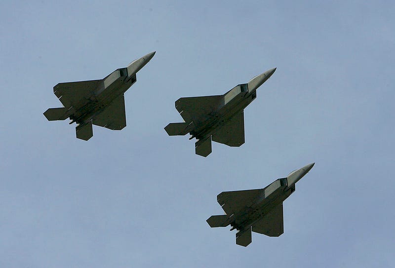 Three F-22 Raptors, fly over the track during pre-race ceremonies prior to the NASCAR Nextel Cup Series Coca-Cola 600 on May 27, 2007 at Lowe's Motor Speedway in Concord, North Carolina
